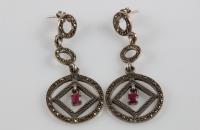 Time circles sterling silver earrings with ruby semi precious stones in the middle